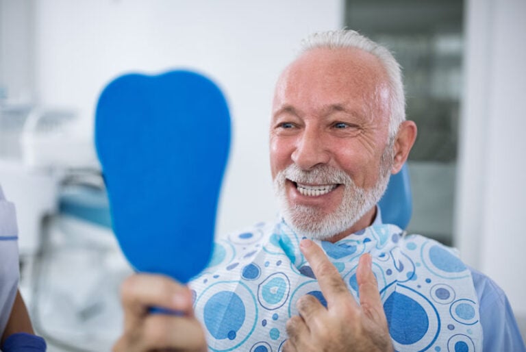 Dental Implant patient smiling after his tooth implant procedure