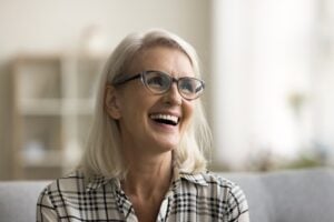 Dentist explaining endosteal implants to a patient in a modern dental office