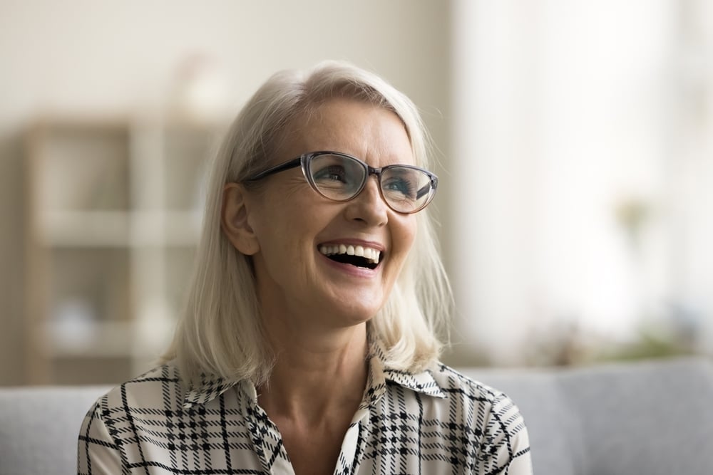 Dentist explaining endosteal implants to a patient in a modern dental office